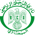 الشعار القديم للنادي والذي ظلت أقمصة الفريق تحمله مدة 53 سنة، أي منذ نشأته سنة 1949 قبل أن يتم تغييره سنة 2001، يُعتقَد أن مصمم الشعار هو الأب جيكو بنفسه الذي حرص على جعل النسر الجارح شعارا للنادي.