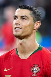 Cristiano Ronaldo in the national jersey, pictured smiling.